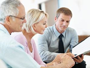 Couple meeting with financial advisor. Link to What to Give Couple meeting with financial advisor. Link to What to Give